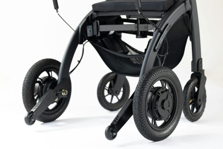 Close-up of a modern wheelchair featuring sleek black wheels on a white background.